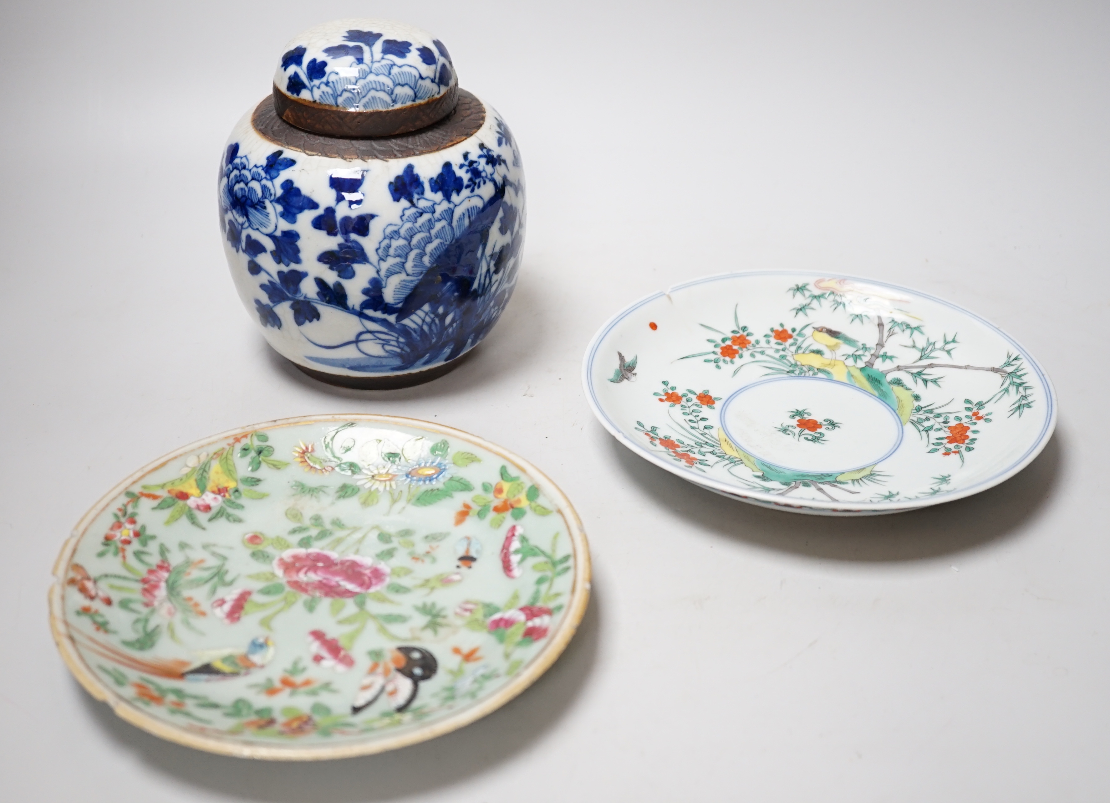 A Chinese famille rose plate, a cantonese plate and a blue and white crackle glaze jar